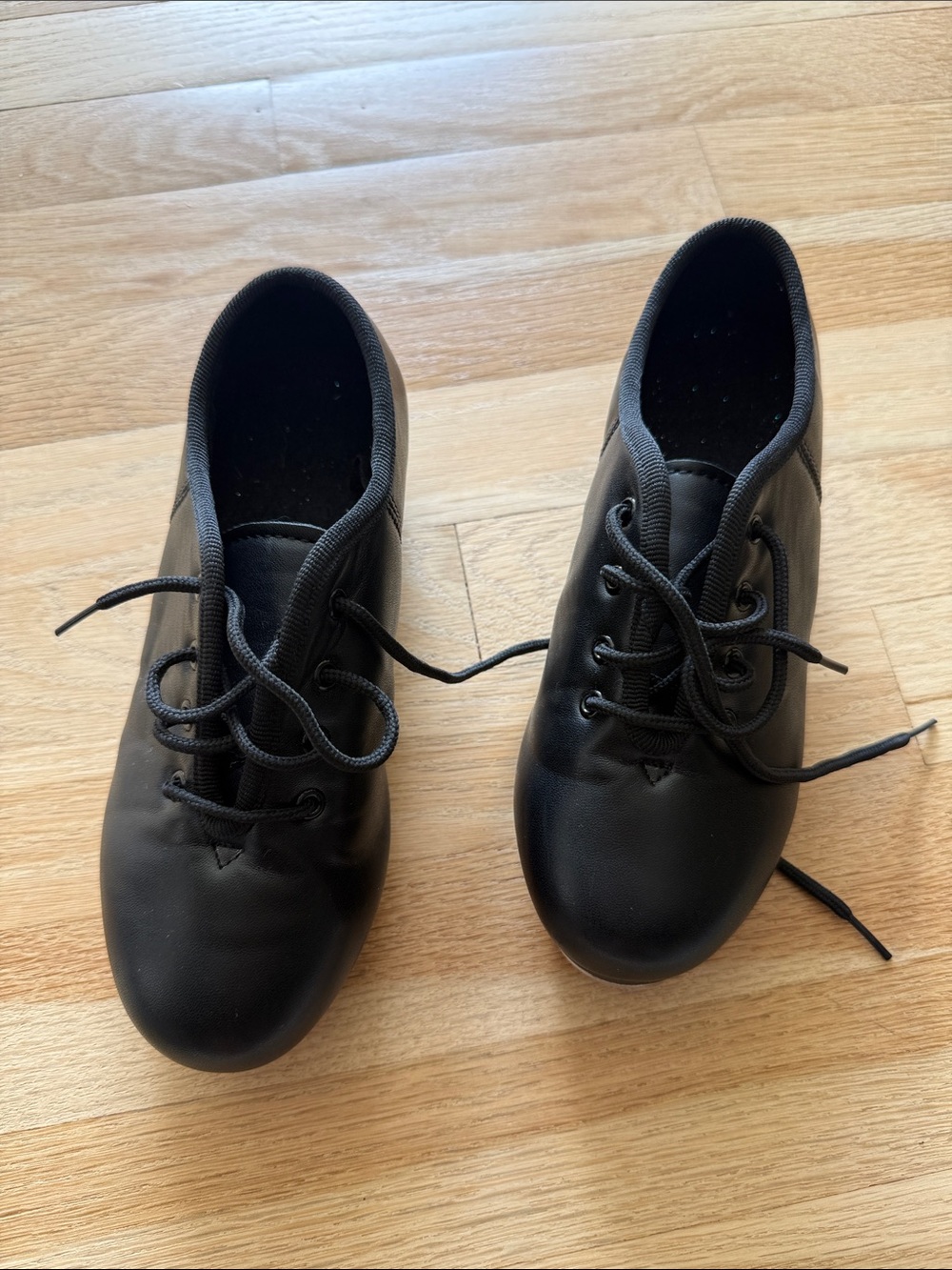 Kids black tap shoe. Left over recital glitter in the shoes 🫠